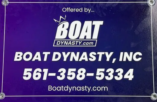 Slide: The Image of Boat Dynasty contact information sign for Cobia 220 Center Console, 2023 model. - 19