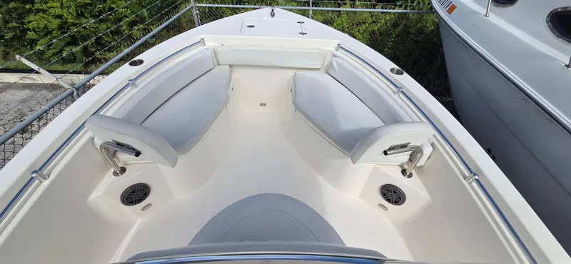 Slide: The Image of 2023 Cobia 220 Center Console boat with spacious seating and sleek design. - 6