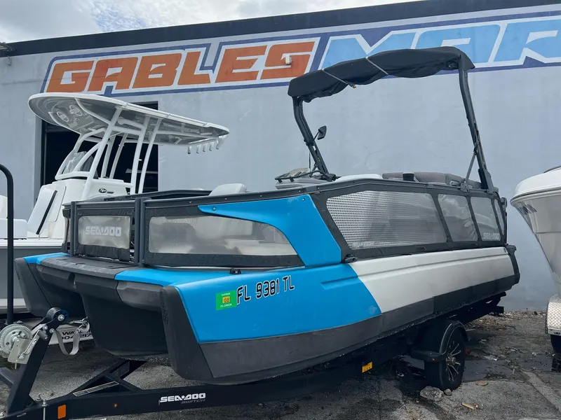 The Image of 2022 Sea-Doo Switch Cruise 21 boat on trailer, parked outdoors near a building. - 0