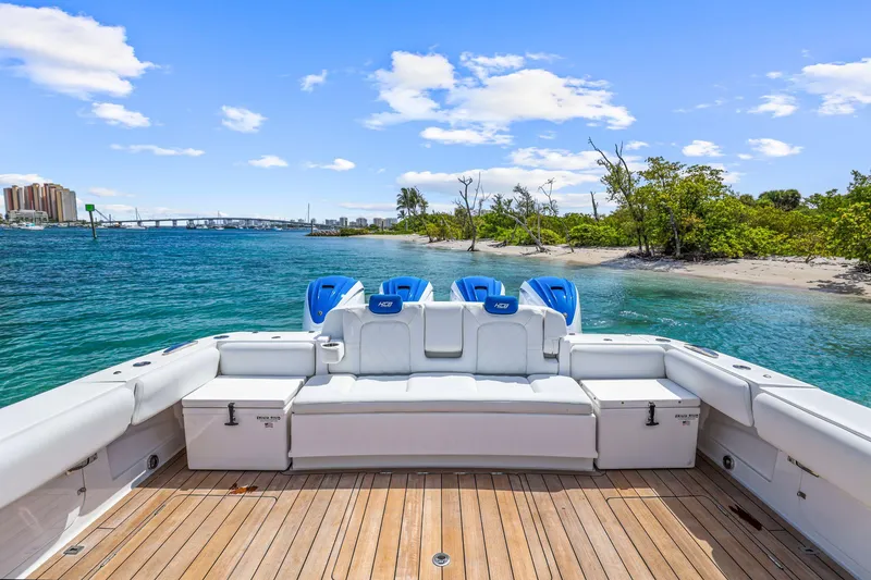 Slide: The Image of Luxury HCB 53 boat with scenic waterfront view, 2020 model, featuring spacious deck and blue skies. - 15