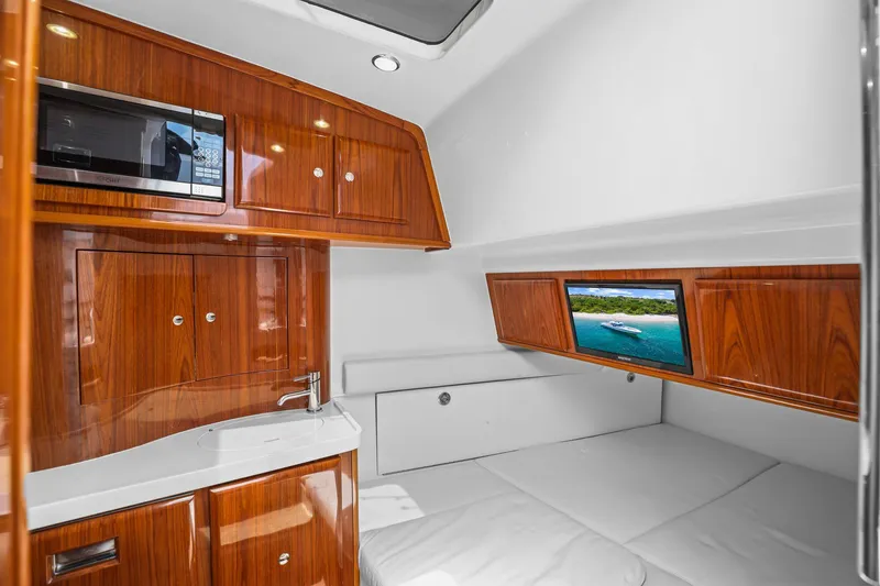 Slide: The Image of Luxurious cabin interior of 2020 HCB 53 yacht with wood finish and modern amenities. - 18