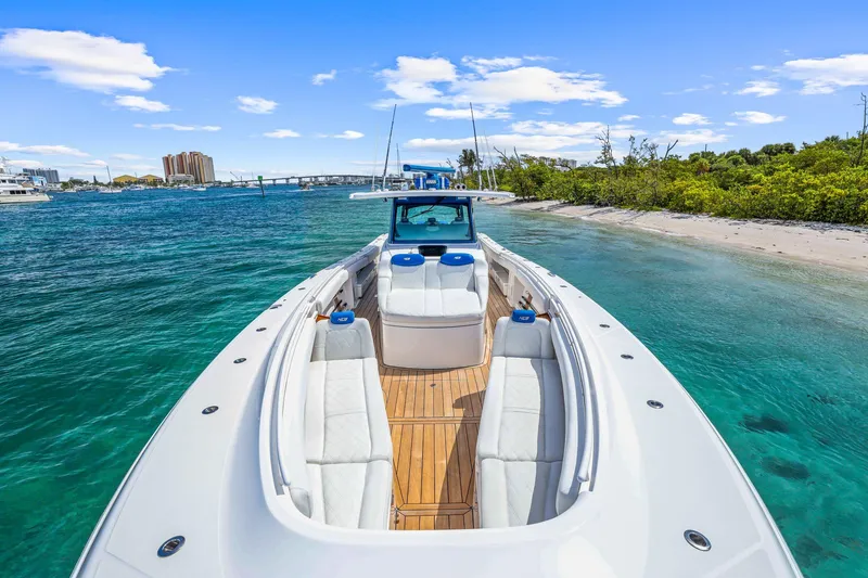 Slide: The Image of Luxury HCB 53 boat docked near a sandy beach, 2020 model. - 20