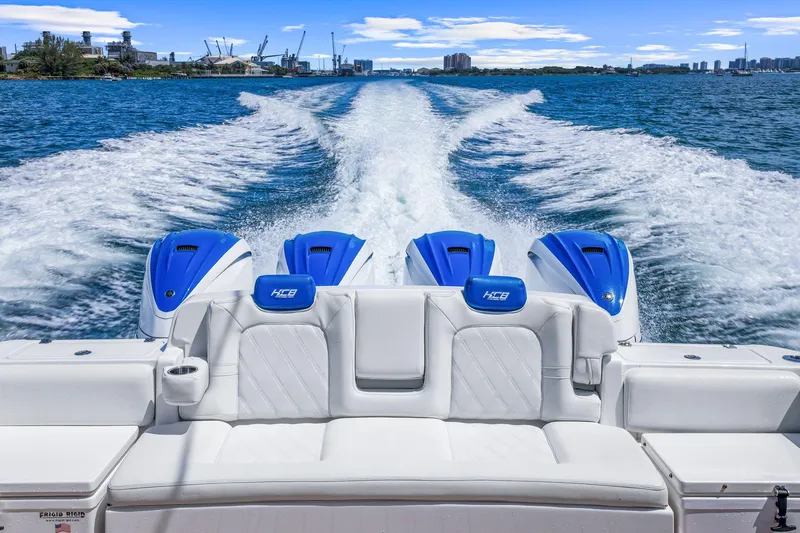 Slide: The Image of Luxury HCB 53 boat cruising on open water, showcasing powerful engines, 2020 model. - 21