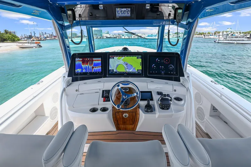 Slide: The Image of Helm of 2020 HCB 53 boat with advanced navigation displays and controls. - 26