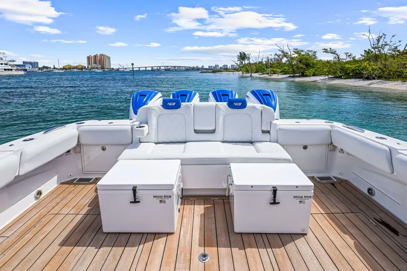 Slide: The Image of Luxury HCB 53 boat deck with seating and coolers, 2020 model, on calm water. - 28