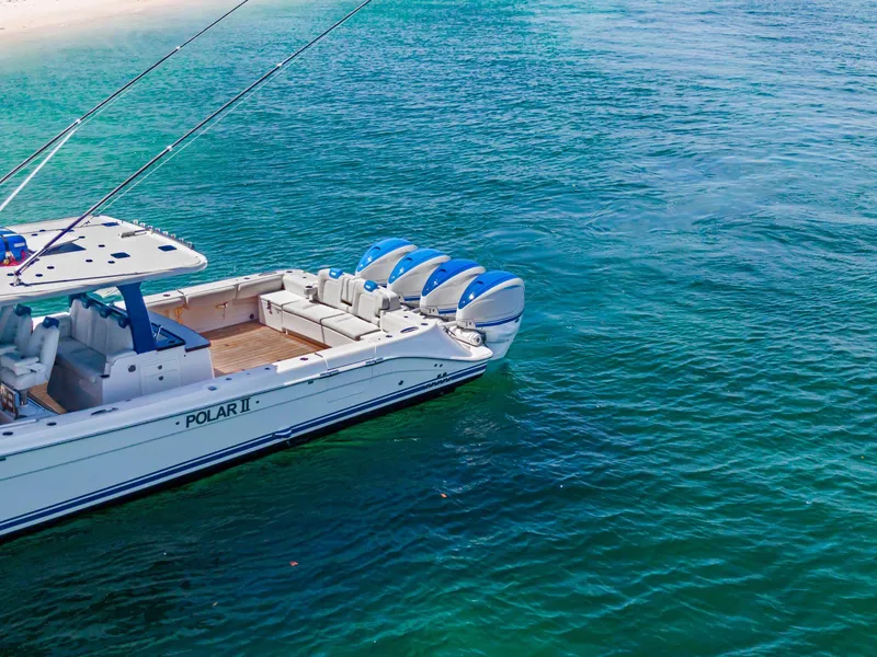 Slide: The Image of Luxury HCB 53 boat from 2020 on clear blue water near sandy beach. - 3