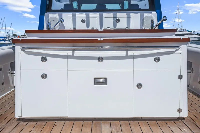 Slide: The Image of 2020 HCB 53 boat interior with sleek cabinetry and wooden accents. - 37