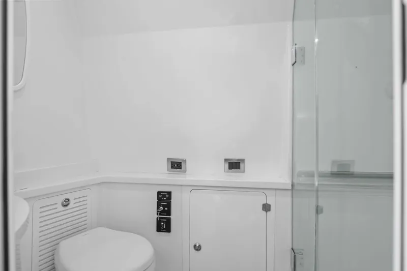 Slide: The Image of Modern bathroom interior on a 2020 HCB 53 yacht, featuring a toilet and glass shower. - 41
