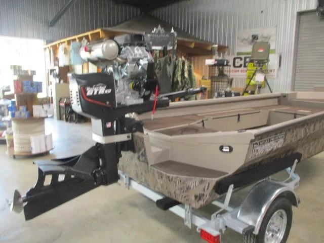 Slide: The Image of 2025 Reaper Boats 656-MUD BOAT in showroom, featuring powerful engine and rugged design. - 2