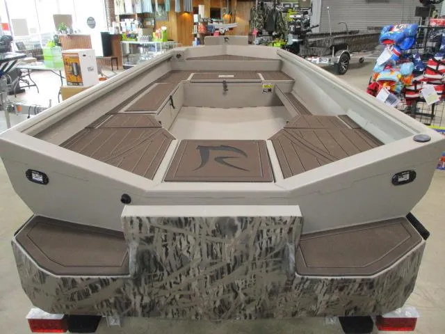 Slide: The Image of 2025 Reaper Boats 656-MUD, camo design, spacious interior, showroom display. - 7