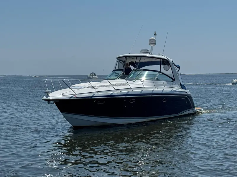 The Image of 2008 Formula 40 PC boat cruising on calm water under clear blue sky. - 0