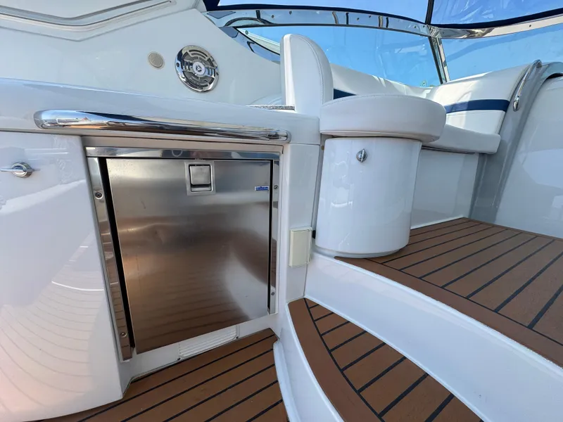 Slide: The Image of 2008 Formula 40 PC yacht interior with stainless steel fridge and teak flooring. - 12