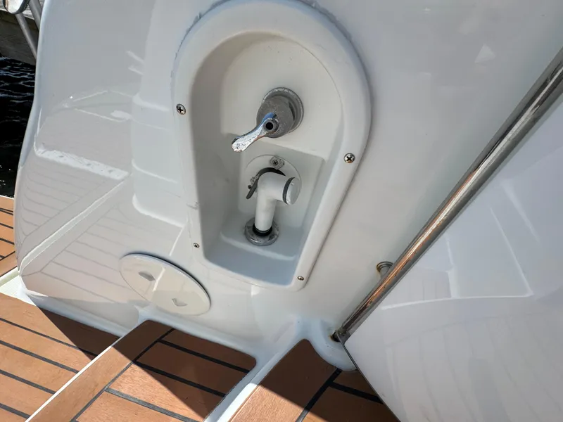 Slide: The Image of 2008 Formula 40 PC boat deck with built-in shower fixture and teak flooring. - 15