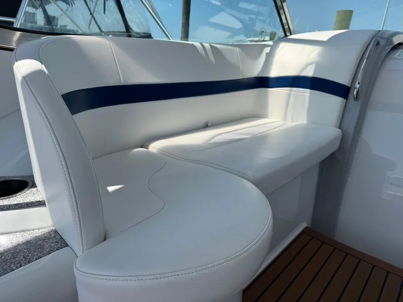 Slide: The Image of Luxurious white seating on a 2008 Formula 40 PC yacht, featuring sleek design and blue accents. - 19