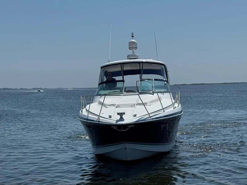 Slide: The Image of 2008 Formula 40 PC yacht cruising on open water under clear blue sky. - 2