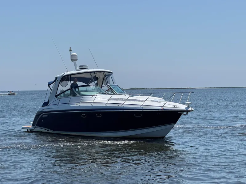 Slide: The Image of 2008 Formula 40 PC yacht cruising on open water under clear skies. - 3