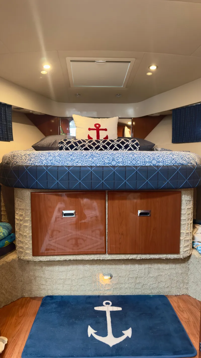 Slide: The Image of Interior of 2008 Formula 40 PC boat with nautical-themed bedding and anchor decor. - 30