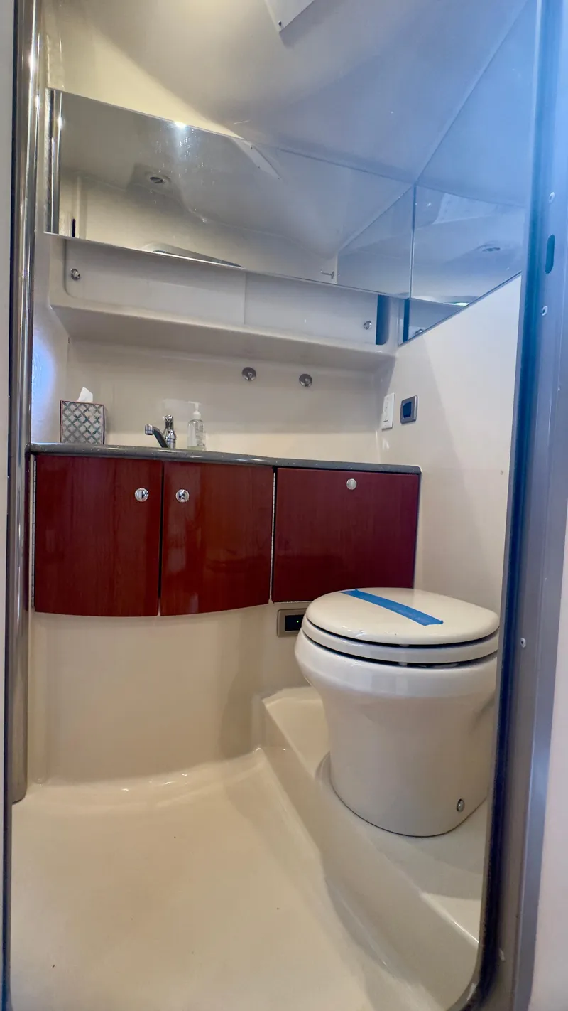 Slide: The Image of 2008 Formula 40 PC yacht bathroom with wooden cabinets and modern fixtures. - 32
