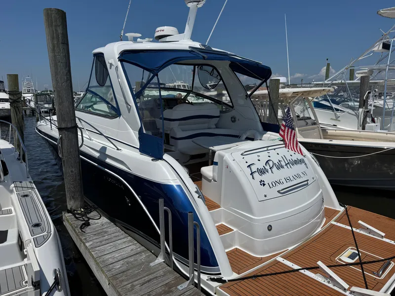 Slide: The Image of 2008 Formula 40 PC yacht docked, featuring blue and white design, Long Island, NY. - 8