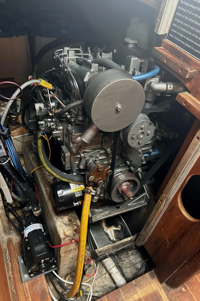 Slide: The Image of 1982 S2 11.0 A engine compartment with visible wiring and components. - 19