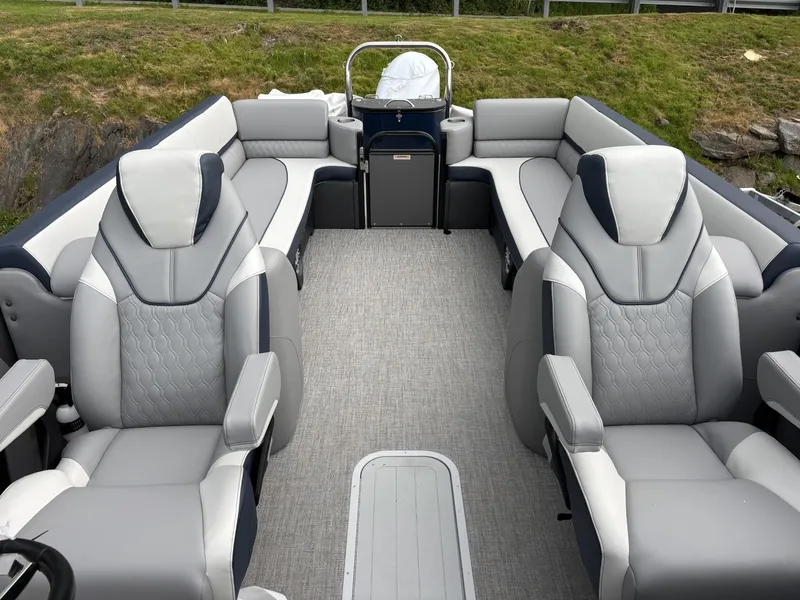 Slide: The Image of 2025 Avalon Catalina Quad Lounger Windshield boat interior with luxurious seating and modern design. - 5