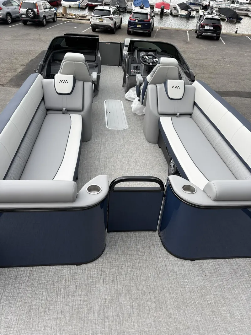 Slide: The Image of 2025 Avalon Catalina Quad Lounger Windshield boat interior with plush seating and modern design. - 8