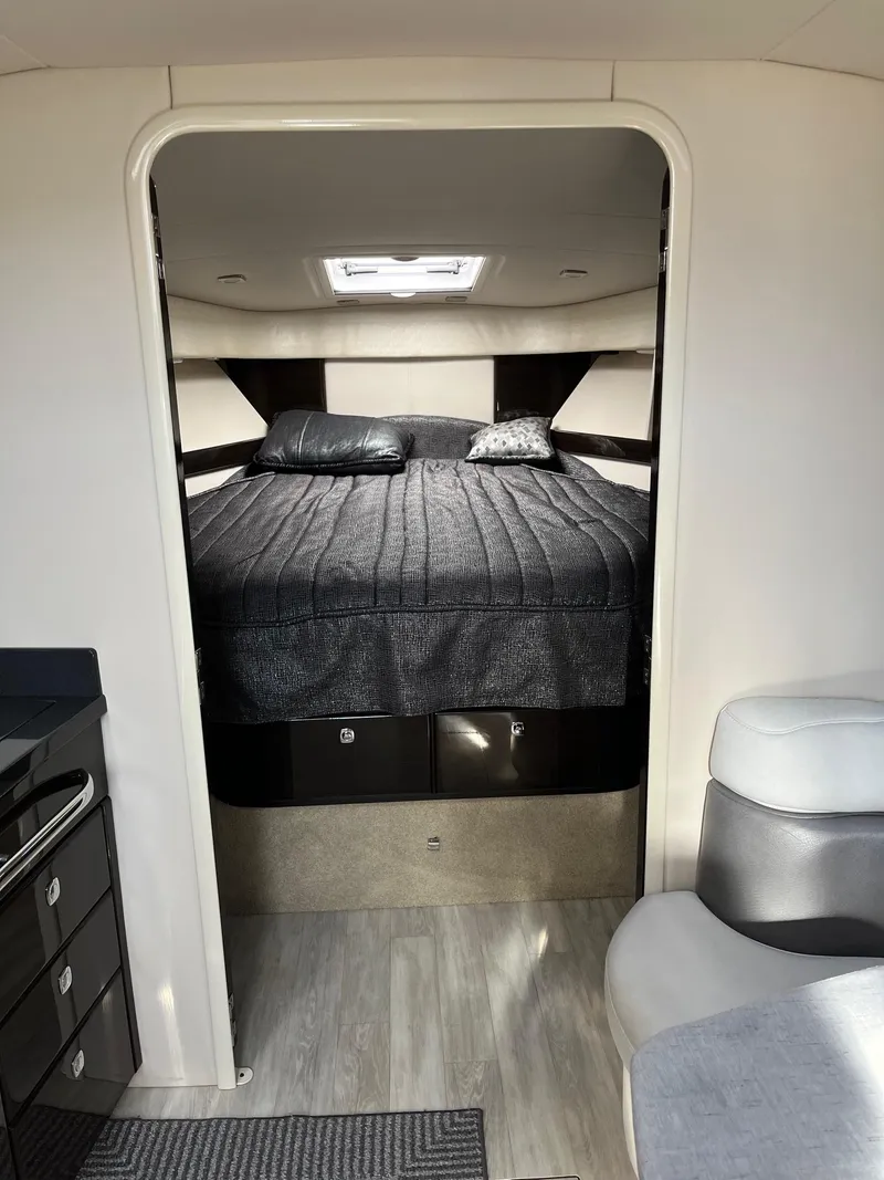 Slide: The Image of Interior cabin of a 2016 Formula 37 PC yacht with a cozy bed and modern design. - 13