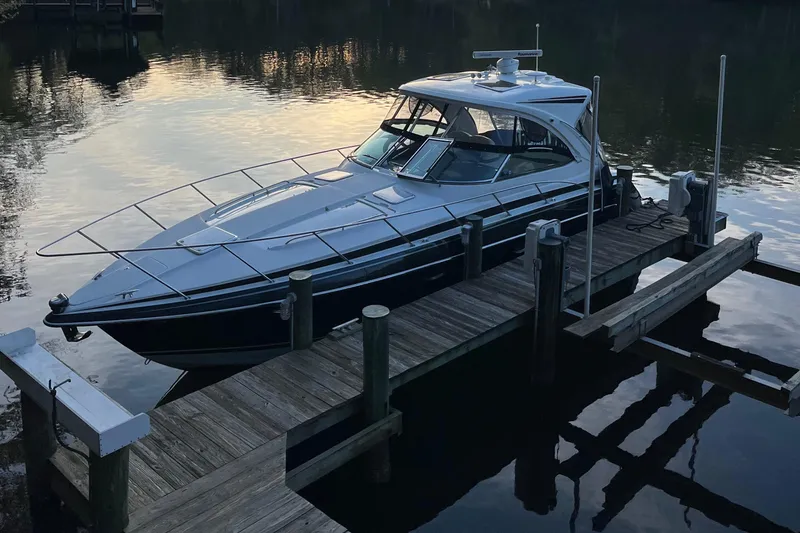 Slide: The Image of 2016 Formula 37 PC yacht docked on calm water at sunset. - 5