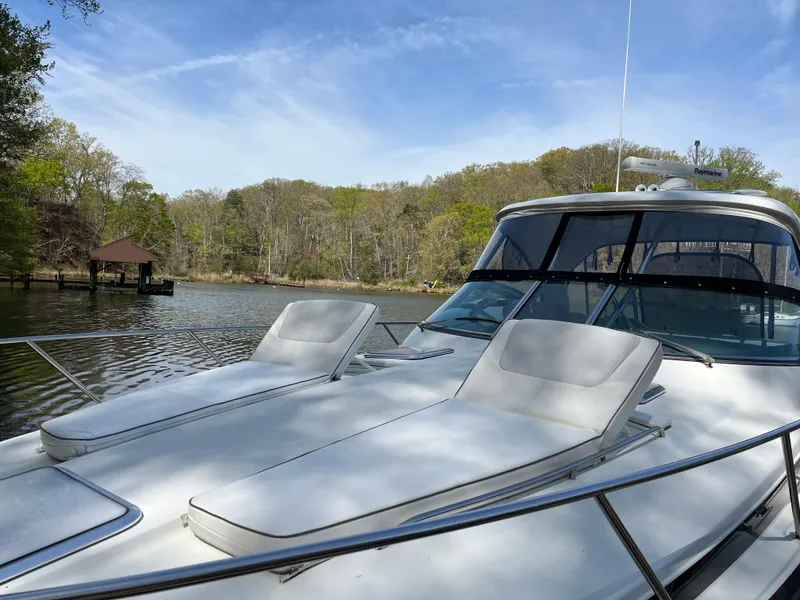 Slide: The Image of 2016 Formula 37 PC yacht with sun loungers on a serene lake. - 7