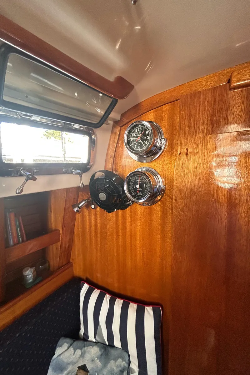 Slide: The Image of Interior of 1980 Bristol 35.5 sailboat with wood paneling and nautical instruments. - 13