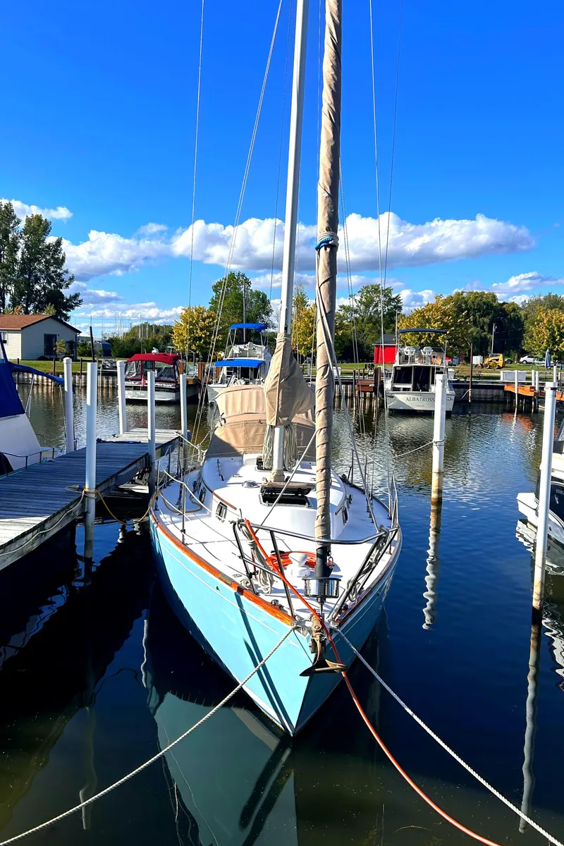 Slide: The Image of 1980 Bristol 35.5 sailboat docked in a sunny marina. - 3