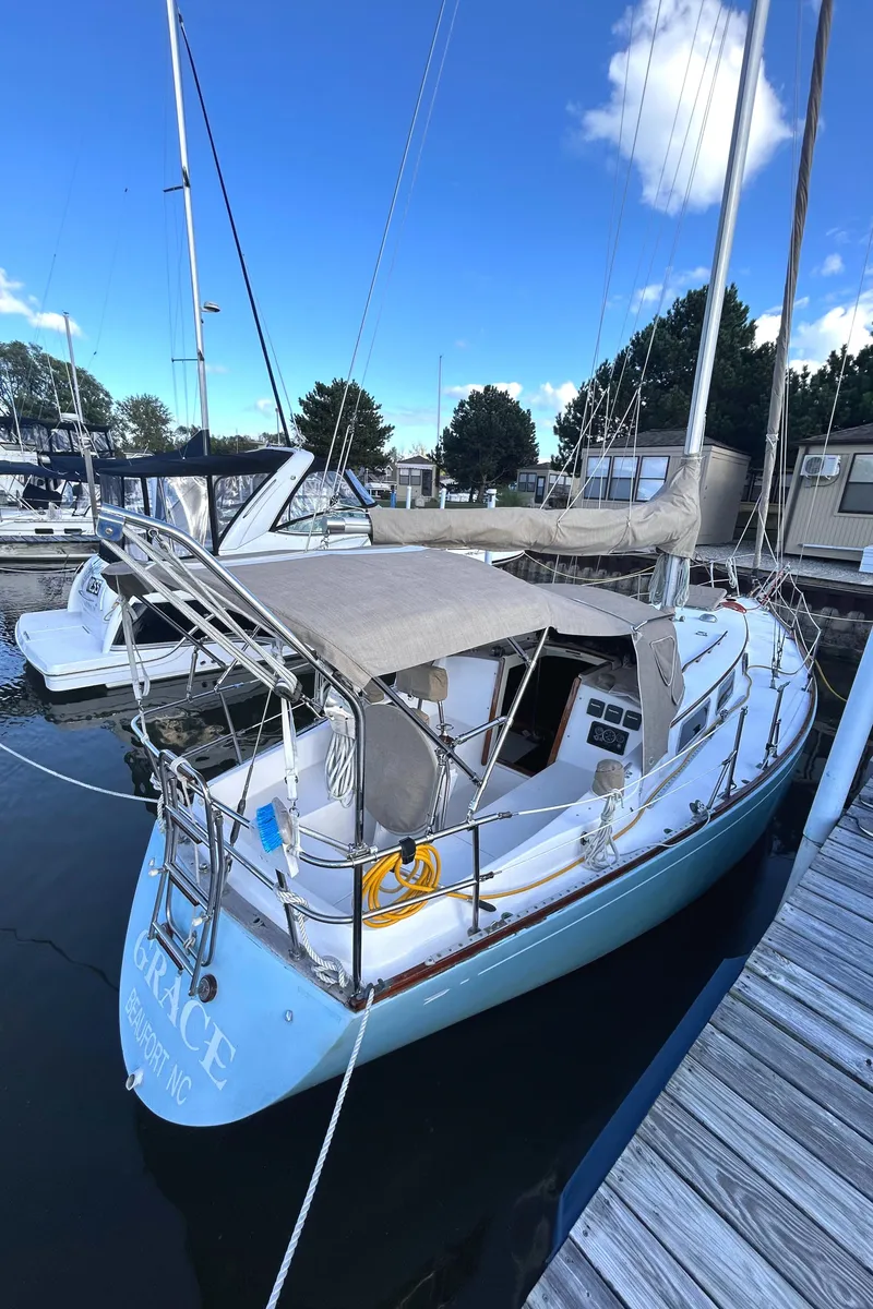 Slide: The Image of 1980 Bristol 35.5 sailboat docked at marina under clear blue sky. - 4