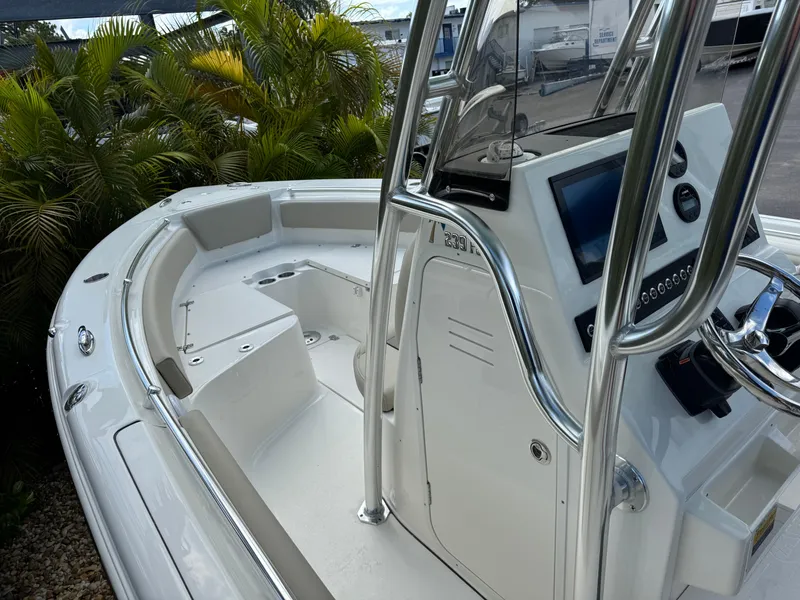 Slide: The Image of 2025 Key West 239 FS boat interior with modern console and seating. - 18