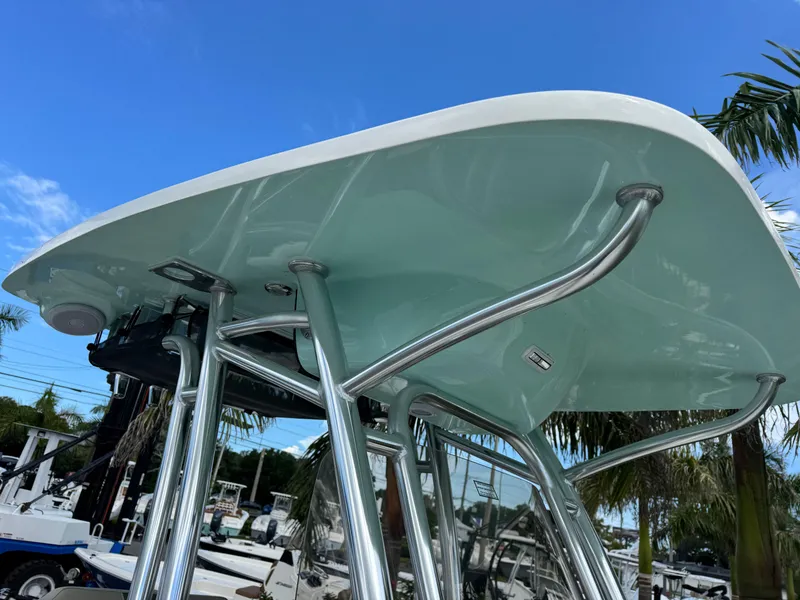 Slide: The Image of 2025 Key West 239 FS boat T-top with stainless steel supports under clear blue sky. - 25