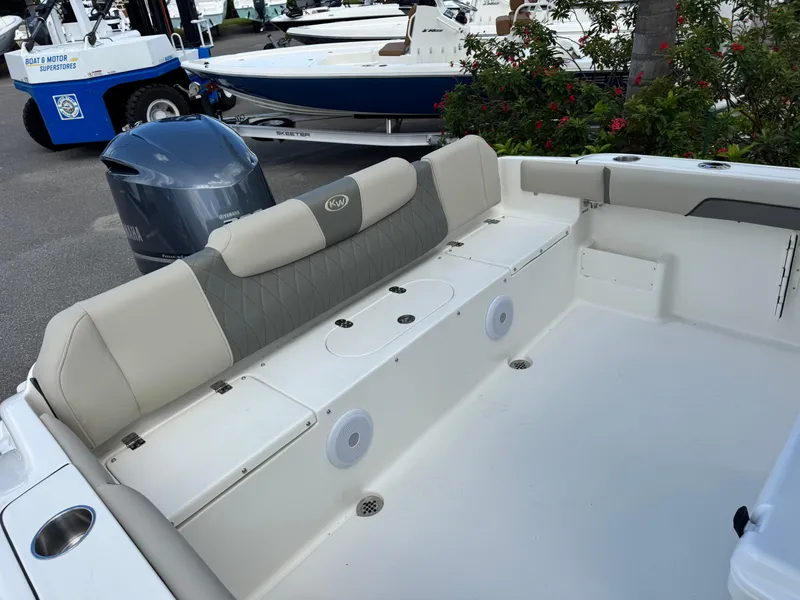 Slide: The Image of 2025 Key West 239 FS boat interior with cushioned seating and storage compartments. - 28