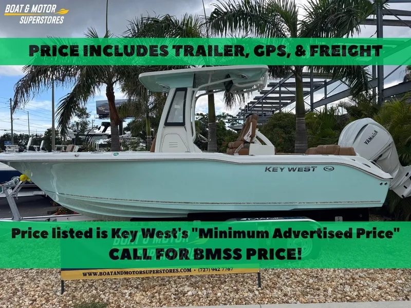 Slide: The Image of 2026 Key West 239 FSR boat with trailer, GPS, and freight included, displayed at dealership. - 1