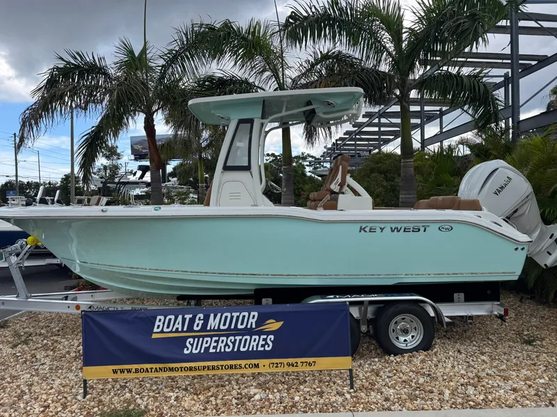 Slide: The Image of 2026 Key West 239 FSR boat on trailer, displayed at Boat & Motor Superstores. - 2