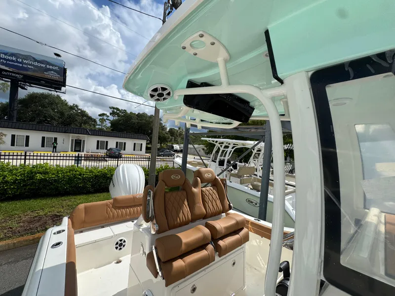 Slide: The Image of 2026 Key West 239 FSR boat with tan seating and modern design features. - 32