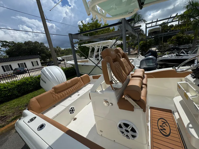 Slide: The Image of 2026 Key West 239 FSR boat interior with tan seating and Yamaha engine. - 33
