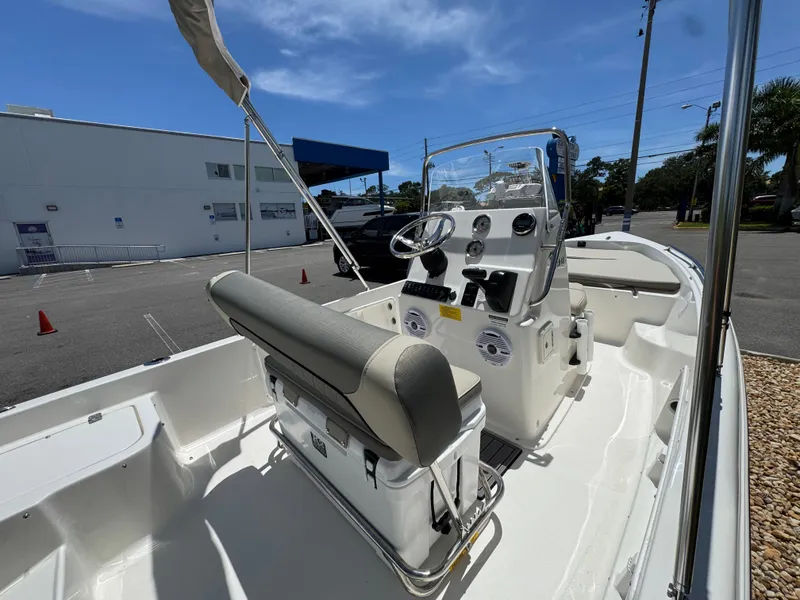 Slide: The Image of 2025 Key West 1720 Center Console boat with sleek design and modern controls. - 12