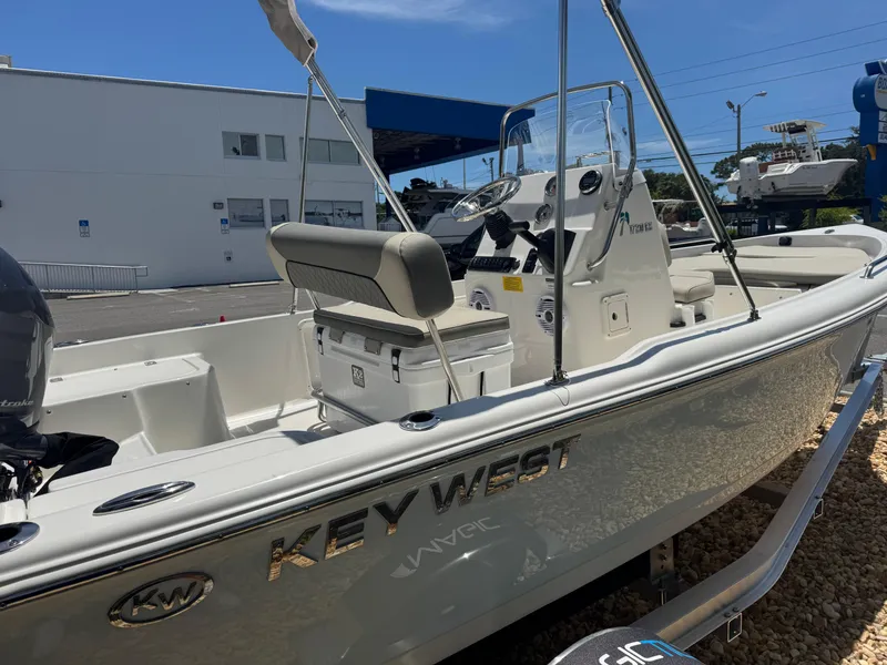 Slide: The Image of 2025 Key West 1720 Center Console boat displayed outdoors, featuring sleek design and modern equipment. - 14