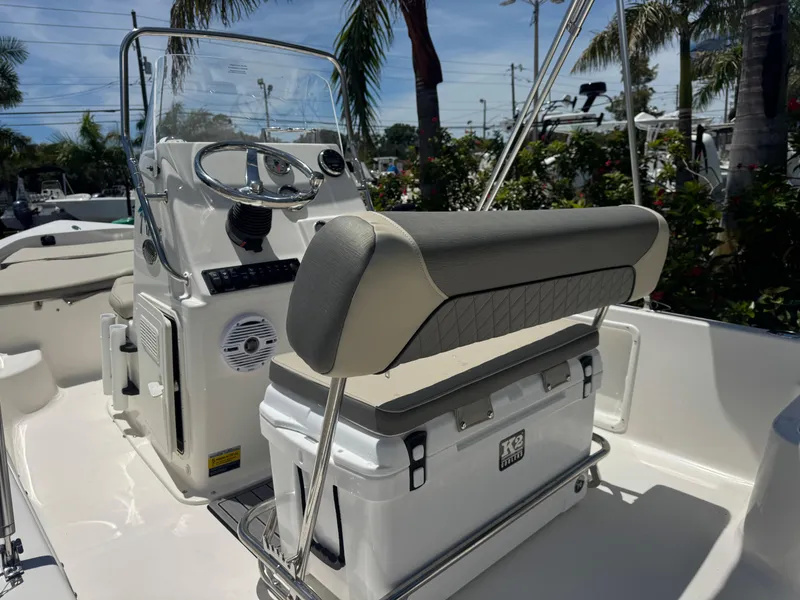 Slide: The Image of 2025 Key West 1720 Center Console boat interior with steering wheel and seating. - 18