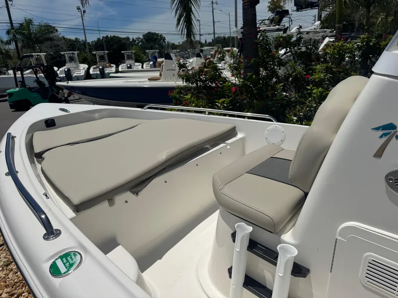 Slide: The Image of 2025 Key West 1720 Center Console boat with beige seating and sleek design. - 20