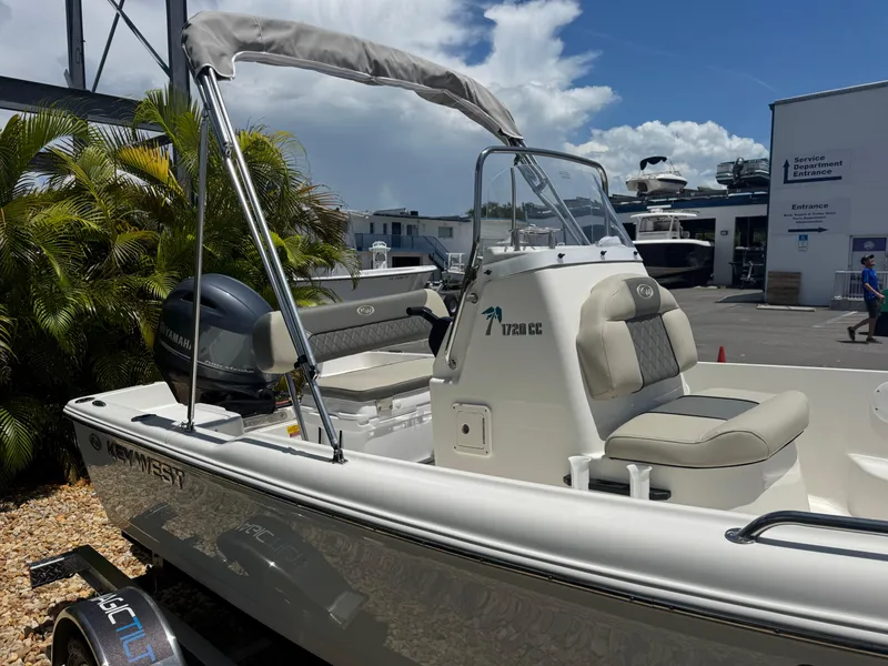 Slide: The Image of 2025 Key West 1720 Center Console boat with Yamaha engine, parked outdoors. - 7