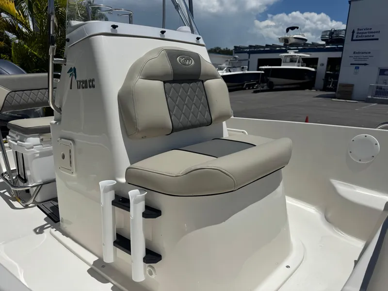 Slide: The Image of 2025 Key West 1720 Center Console boat interior with cushioned seating and rod holders. - 9