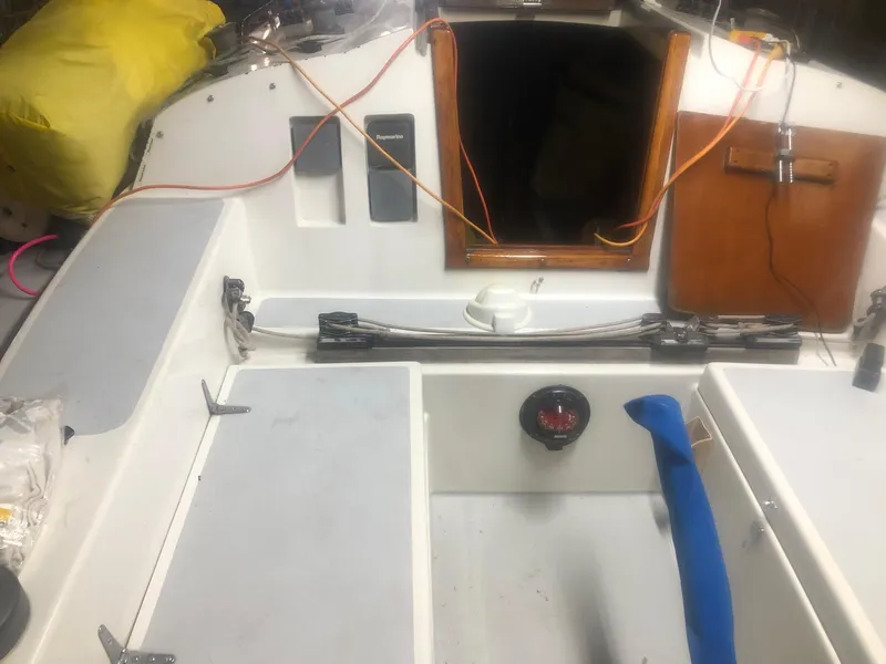 Slide: The Image of 1979 C&C 29 sailboat cockpit with open hatch and visible rigging. - 2