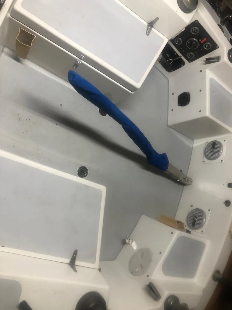 Slide: The Image of Cockpit of a 1979 C&C 29 sailboat with blue tiller and control panels. - 3