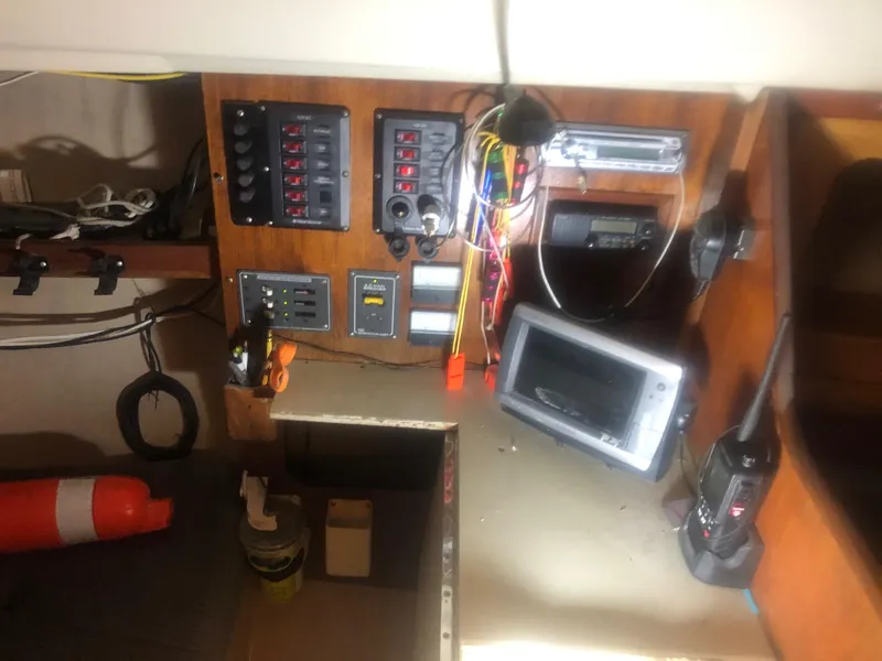 Slide: The Image of Electrical panel and navigation equipment inside a 1979 C&C 29 sailboat cabin. - 5