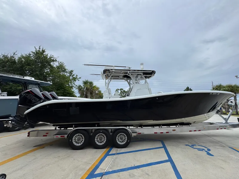 Slide: The Image of 2021 Yellowfin 36 Offshore boat on trailer, parked outdoors. - 10