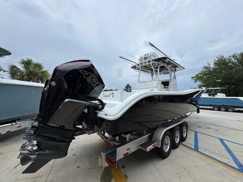 Slide: The Image of 2021 Yellowfin 36 Offshore boat on trailer with powerful outboard engine. - 11
